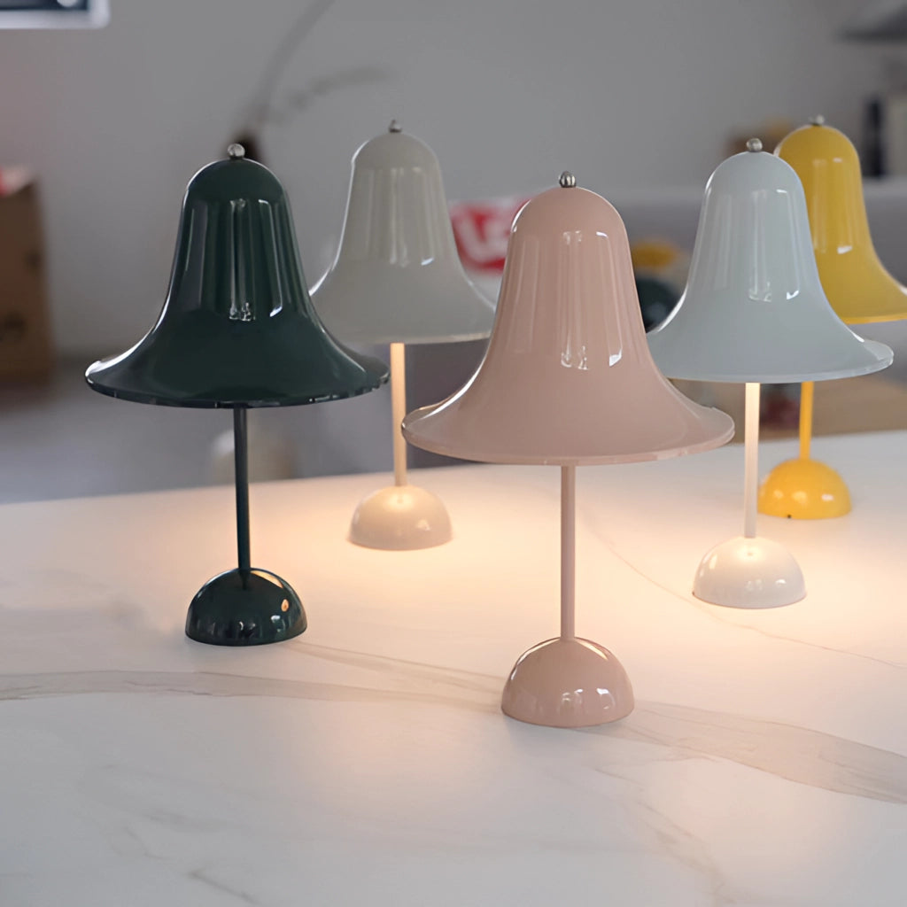 Rechargeable LED lamp with touch sensor on a wooden shelf, featuring a sleek circular design and metallic accents.