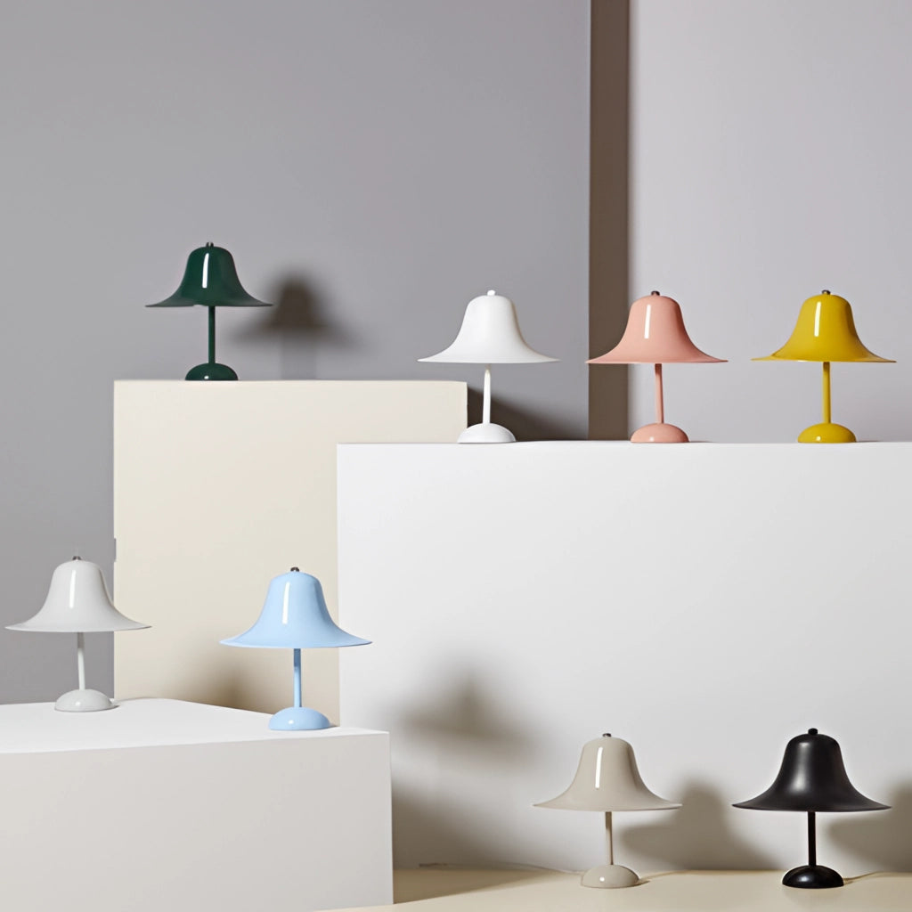 Rechargeable LED lamp with touch sensor placed on a wooden shelf, featuring a sleek grey design, blending with modern interior decor elements.