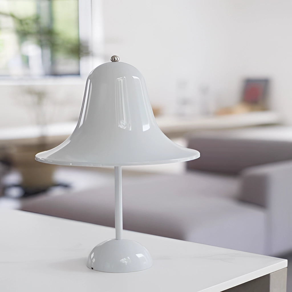Rechargeable LED lamp with touch sensor on a wooden table, featuring a sleek metal base and a tinted lampshade.