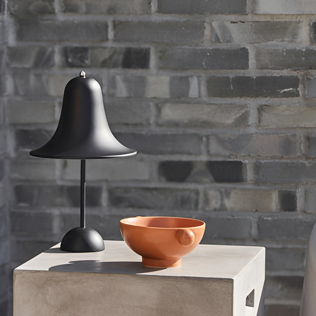Rechargeable LED lamp with touch sensor, black and wood finish, minimalistic design, placed on a table.