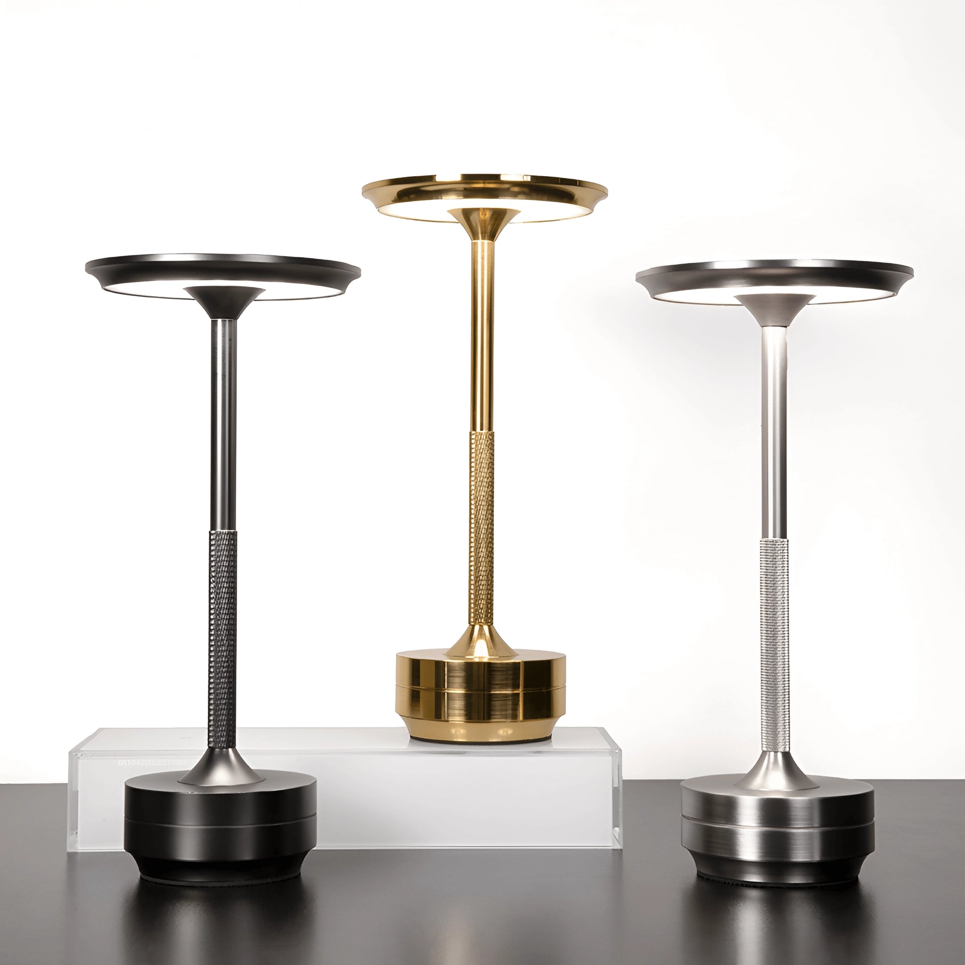Rechargeable LED table lamp with a sleek, cordless design, featuring a metallic finish and modern aesthetic, ideal for mood lighting in various settings.