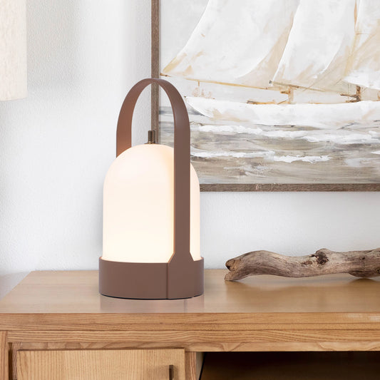 Rechargeable table lamp with touch dimming feature on a wooden table.