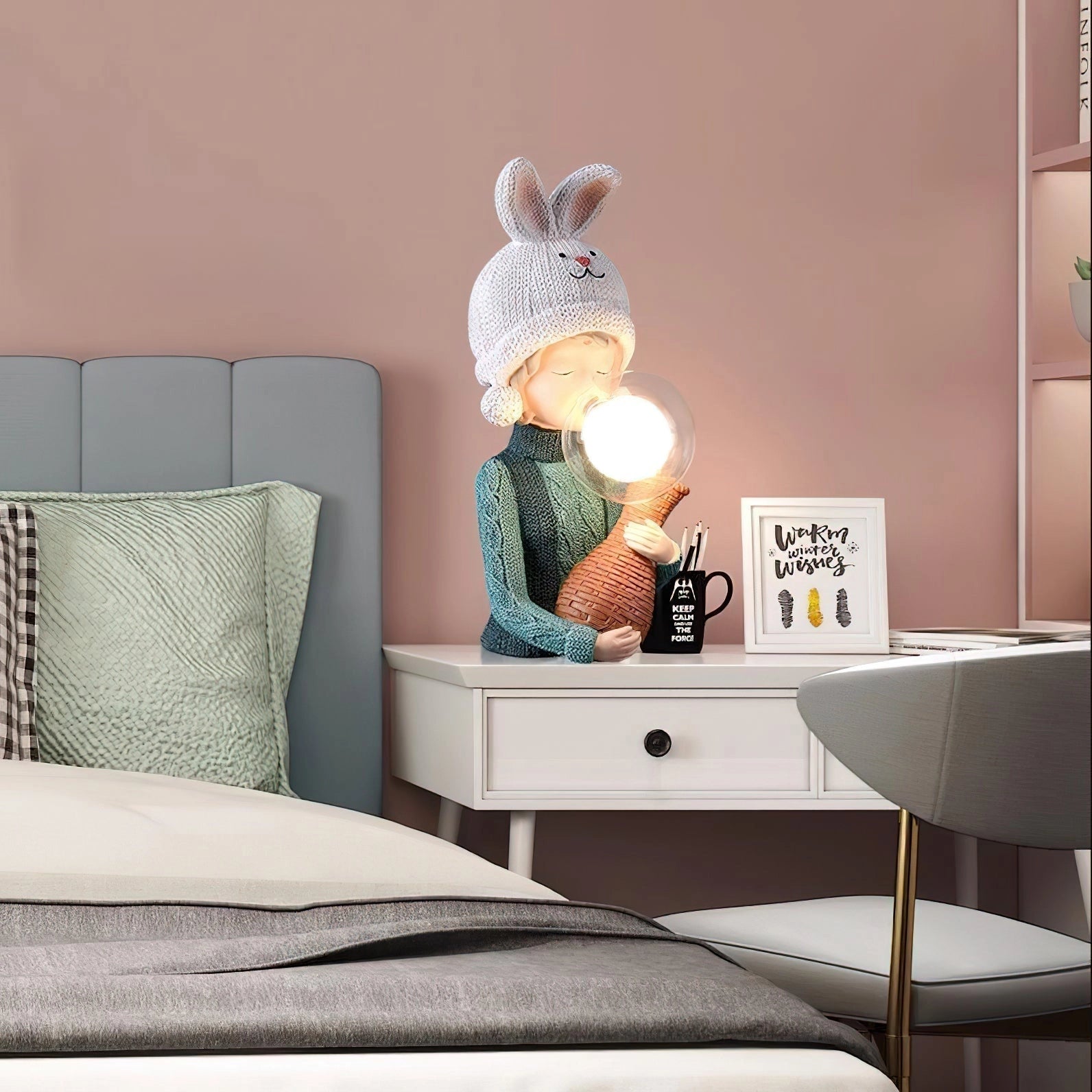 Resin table lamp featuring an elegant rabbit girl design with dual glass lampshades, placed on a wooden rectangular table in a stylish interior setting.