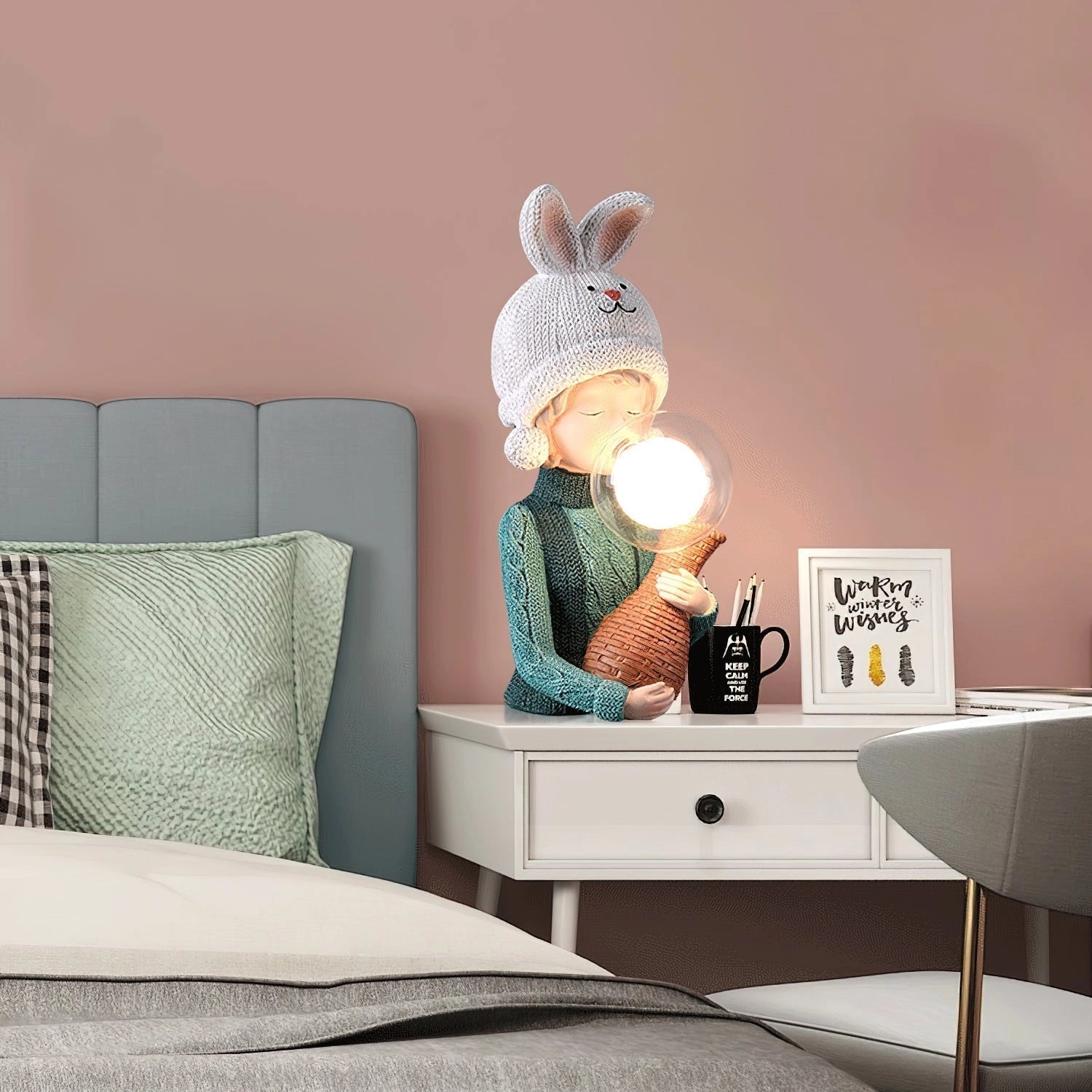 A decorative resin table lamp featuring a charming rabbit girl figure, dual glass lampshades, and a grey rectangular wooden base, perfect for adding a touch of elegance and comfort to interior design settings.