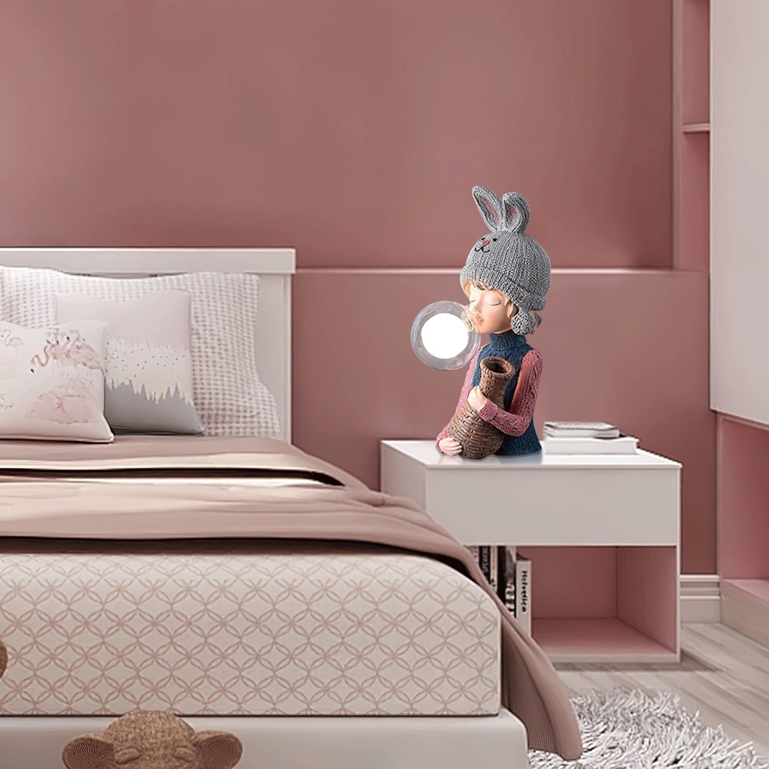 Resin table lamp featuring an elegant rabbit girl design with a dual glass lampshade, placed on a wooden nightstand in a cozy, stylish bedroom interior with grey textiles and pillows.