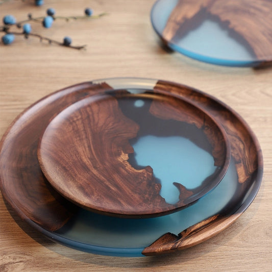Handcrafted resin wood tray with a blue epoxy resin design, combining natural wood and creative arts for a unique serveware piece.