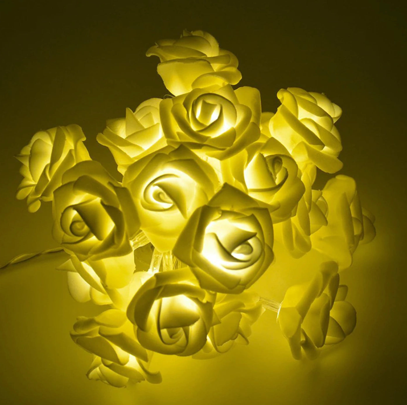 Rose Flower LED String Lights featuring elegant rose-shaped bulbs in a soft gold hue, arranged in a string.