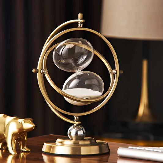 Elegant rotating globe hourglass timer with a metal base and classic design, featuring an antique globe atop an hourglass filled with sand.