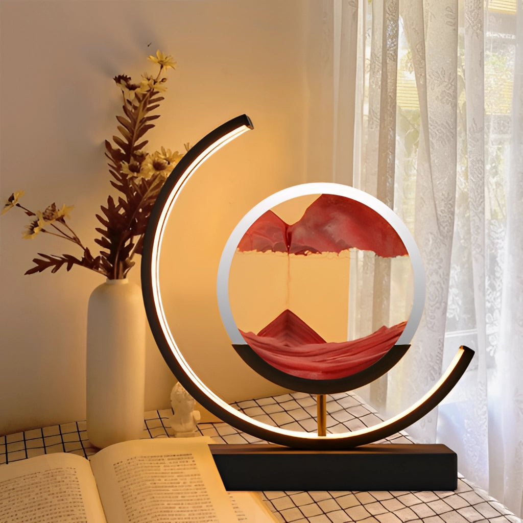 Sand Art LED Table Lamp featuring dynamic 3D sand painting light, with a modern rectangular design, wood branches, and soft lighting, perfect for interior design in a living room.