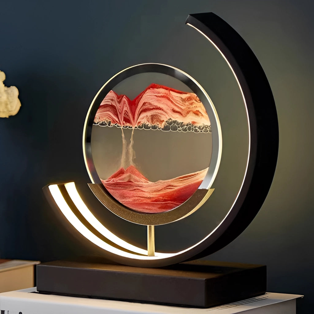 A dynamic 3D sand painting light in an LED table lamp, featuring an orange-hued circular design with flowing sand art enclosed in a sleek, modern frame.