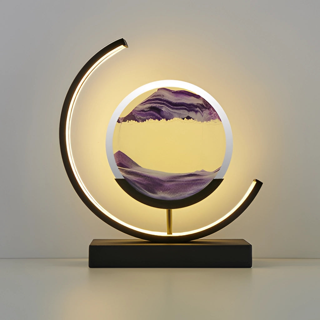 A violet and black Sand Art LED table lamp featuring a dynamic 3D sand painting light, with a circular and oval design against a dark backdrop.
