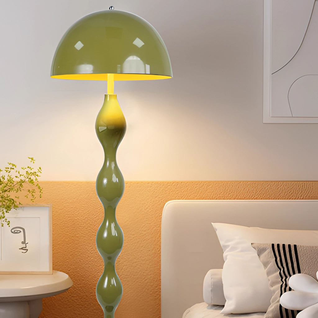 Scandinavian LED floor lamp with adjustable brightness in green, featuring a Nordic style design with a wooden base and white textile lampshade, emitting warm yellow light.