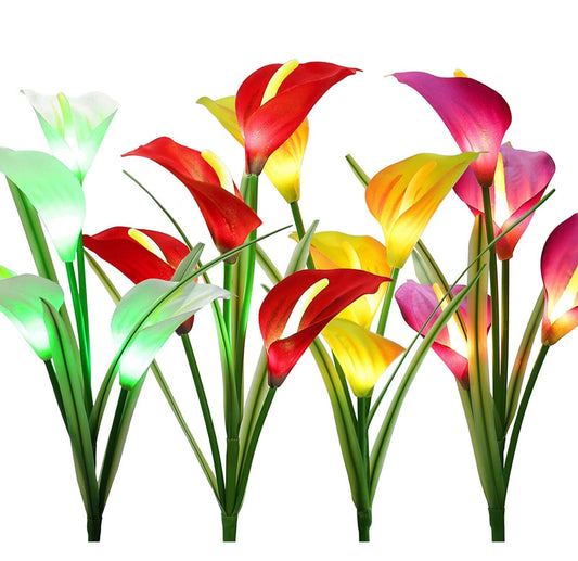 Set of 4 Solar Lily Garden Lights with Multi-color LEDs illuminating a garden with vibrant, lifelike lily flowers.