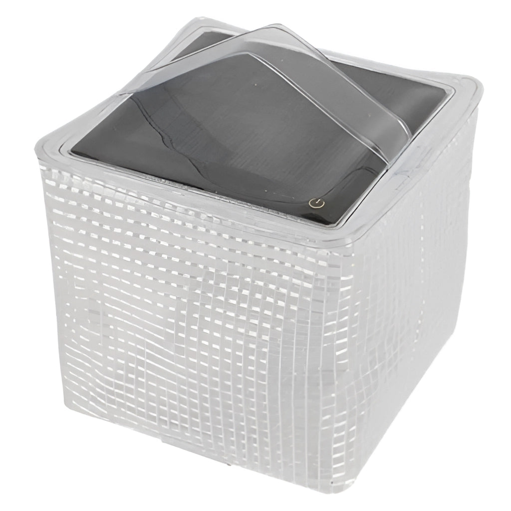 Portable solar outdoor light in white, rectangular shape, shown in packaging with automotive tire nearby, featuring IP65 waterproof rating and long battery life.