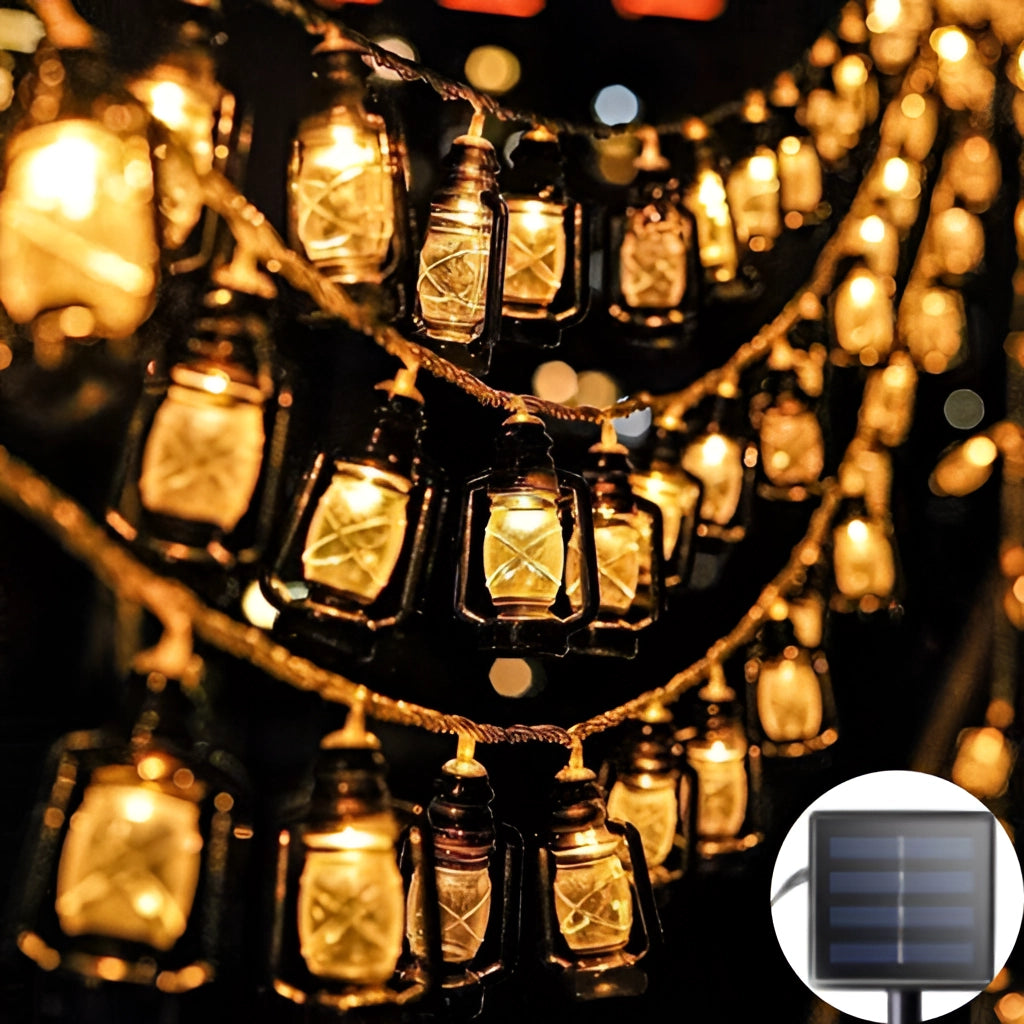 Outdoor solar string lights with LED lanterns in RGB and white colors, illuminated with a warm amber glow, IP65 waterproof.