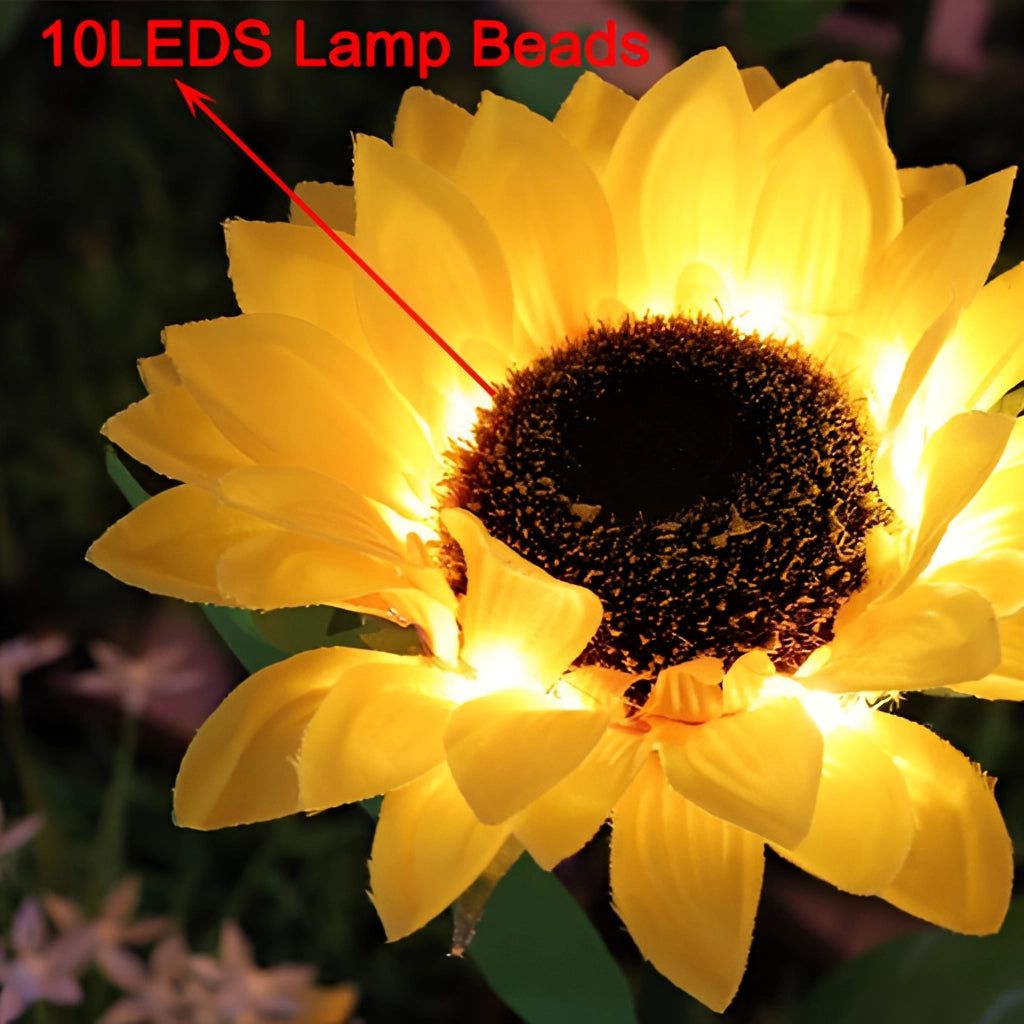 Solar Sunflower Garden Lights Pack of 4 featuring yellow petals and realistic flower design illuminated by sunlight.