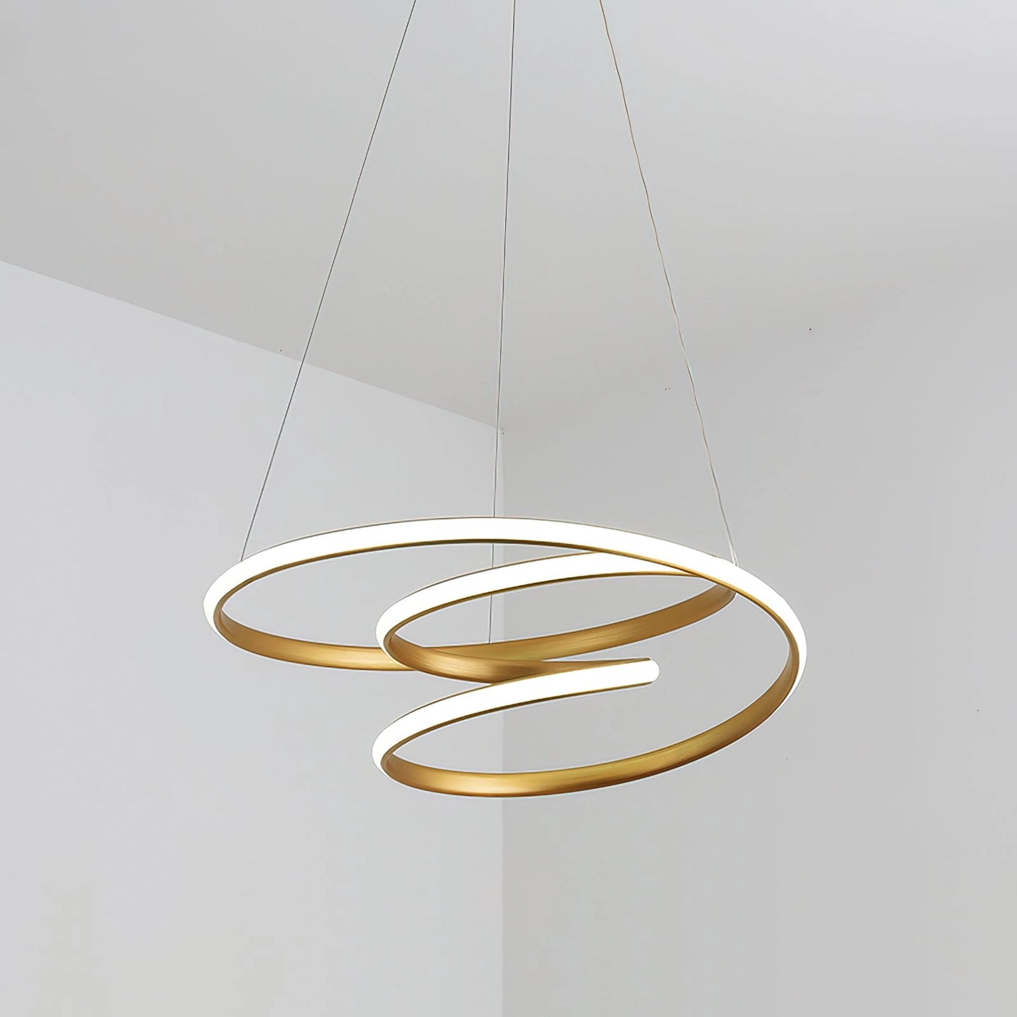 Modern spiral pendant light made of aluminum with warm illumination, featuring an elegant oval design.