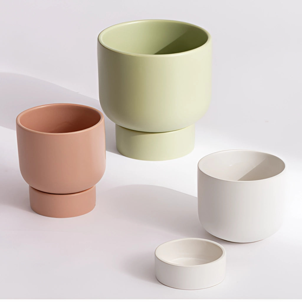 Ceramic vase with stacked flower pot design for garden and bonsai, displayed on a table.