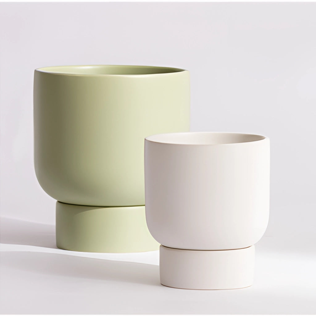 Ceramic stacked flower pot vase for garden and bonsai on a table.
