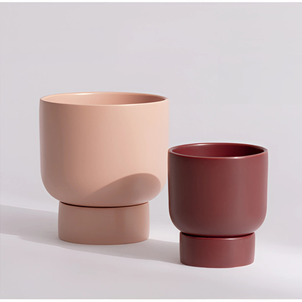 A ceramic stacked flower pot vase for garden and bonsai placed on a table.