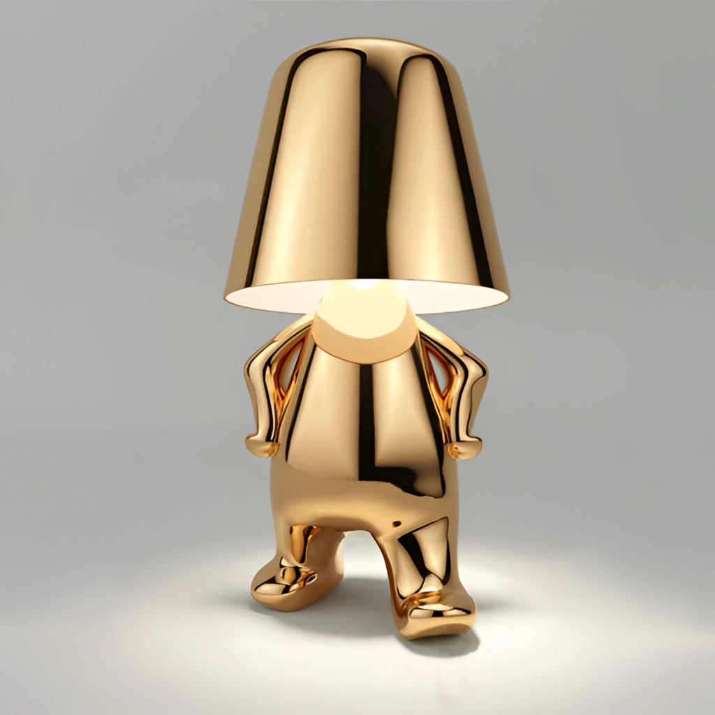 Gold Stylish Thinker Lamp named Luka, featuring a serene design perfect for desk and nightstand lighting, with wooden base and metal accents.
