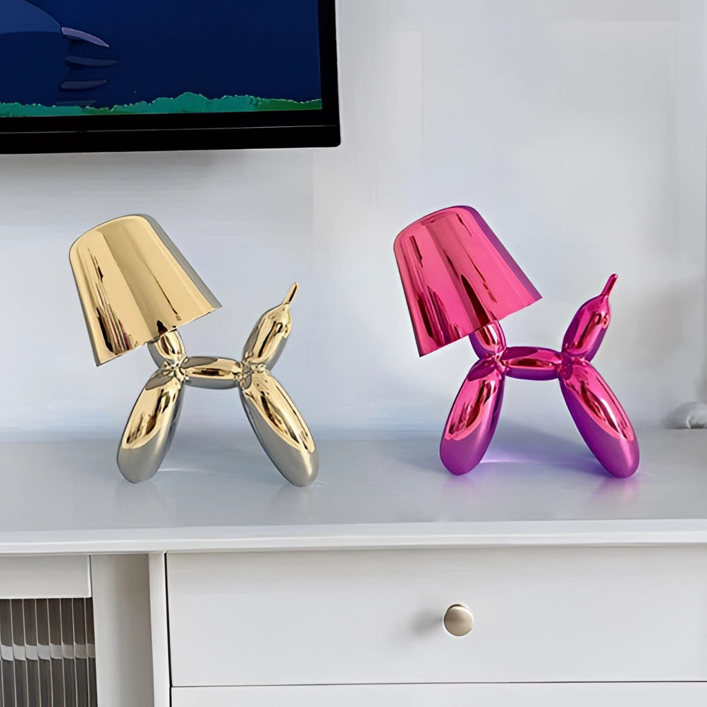 A purple crystal table lamp with a dimmable touch-sensitive feature and a balloon dog design.