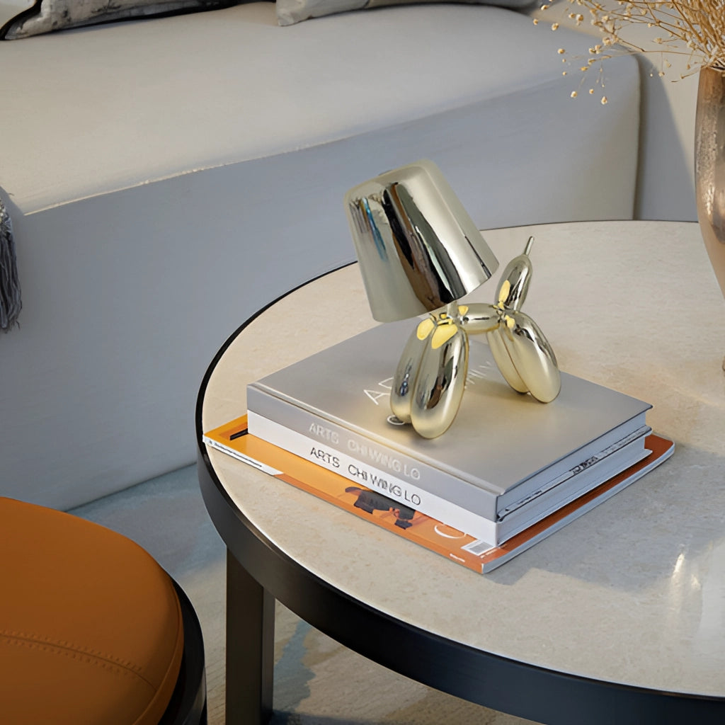 Crystal touch-sensitive dimmable table lamp with balloon dog design on a desk.