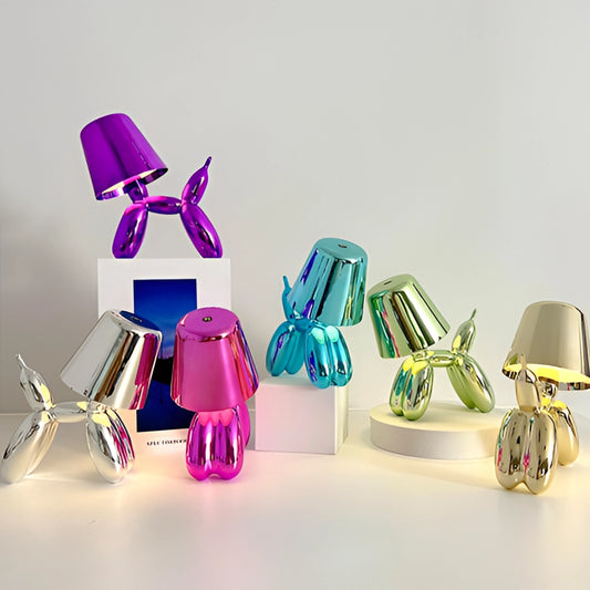 Crystal touch-sensitive dimmable table lamp with a balloon dog design in purple and violet colors, placed on a table.