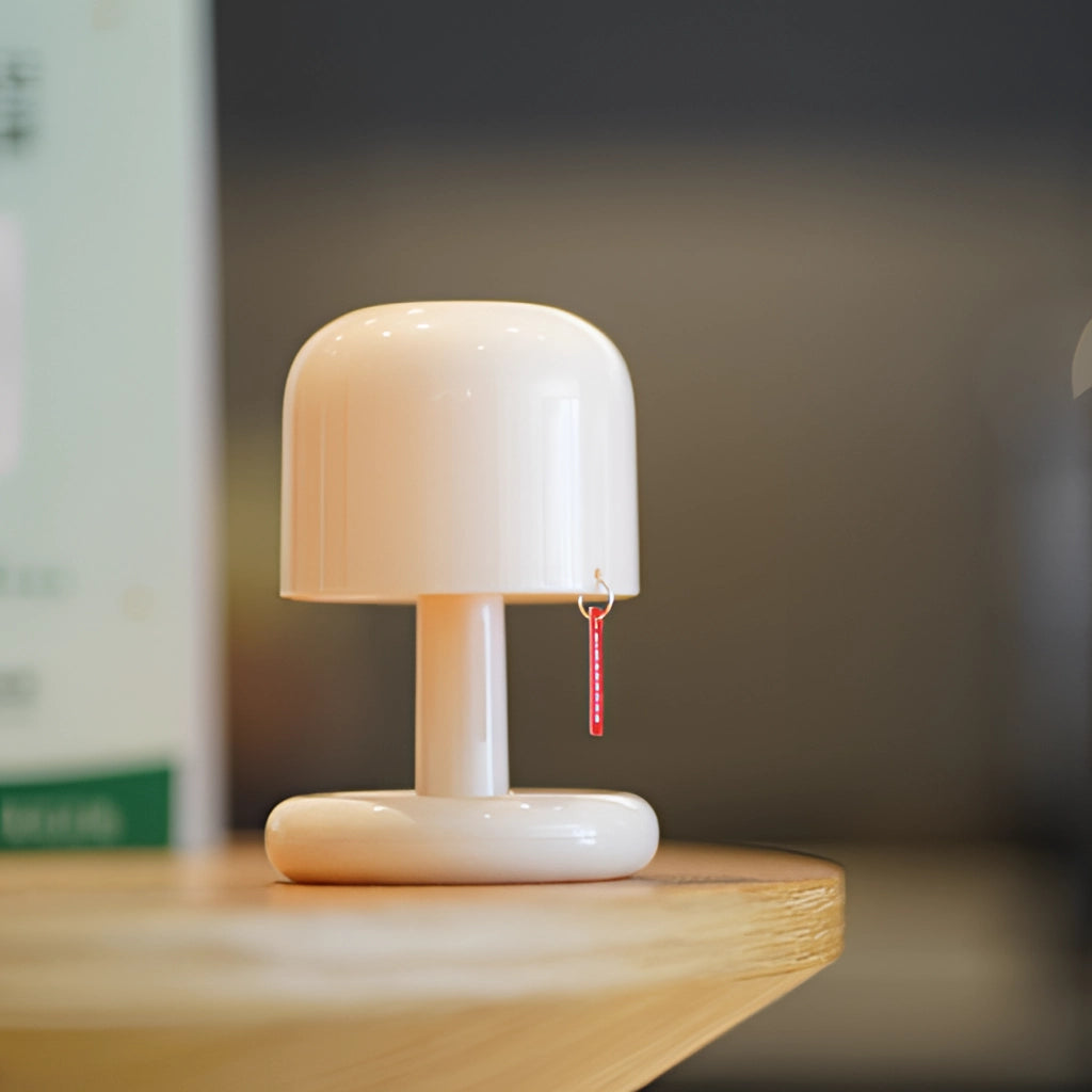Ivory table lamp with touch switch and dimmable feature, featuring a wooden base and sleek design, showcased in still life photography.