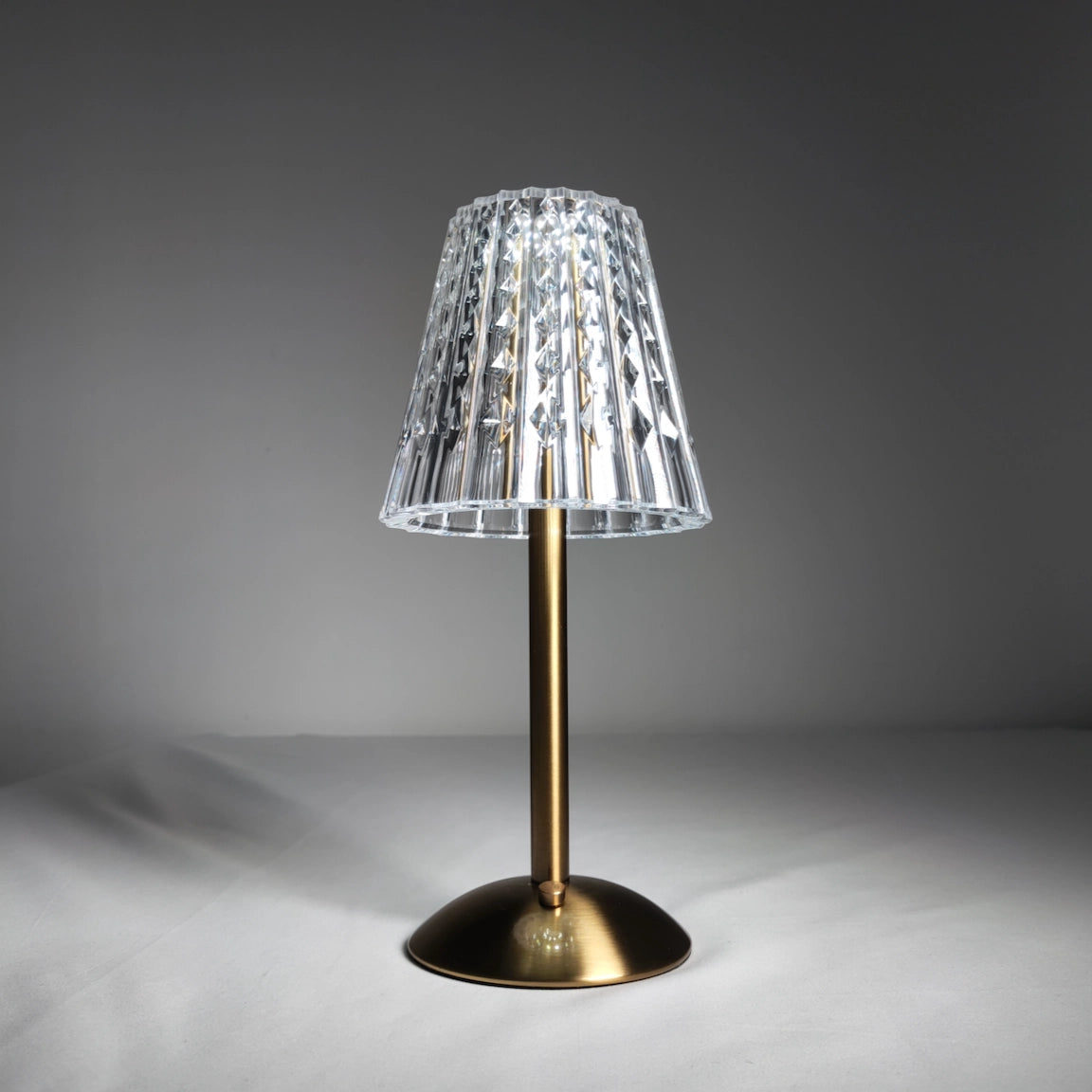 Table Lamp Tricolor Dimmable Cordless LED with sleek design featuring wood, glass, and metal elements, artistic lampshade, and natural material accents.