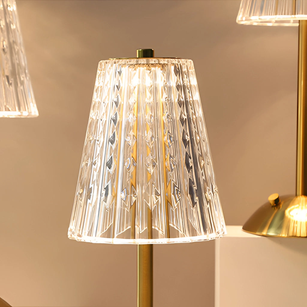 A cordless LED table lamp with a tricolor dimmable feature, featuring a captivating design with a wooden base and metal elements.