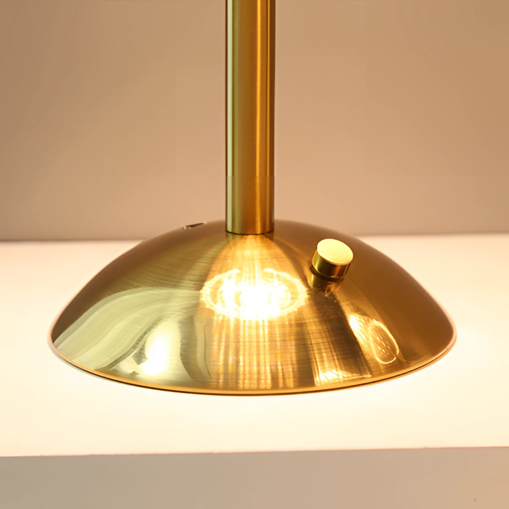 A dimmable cordless LED table lamp with a tricolor light feature, wooden base, and metal accents, emitting a warm amber glow.