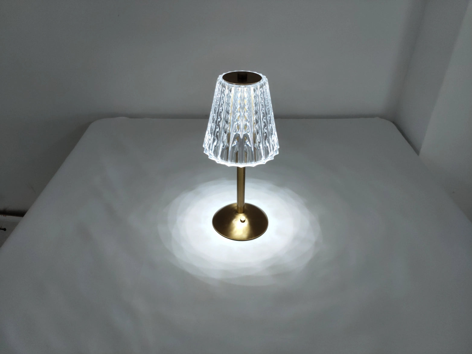 Table Lamp Tricolor Dimmable Cordless LED with wooden base, circular lampshade, and modern design placed on a wooden table.