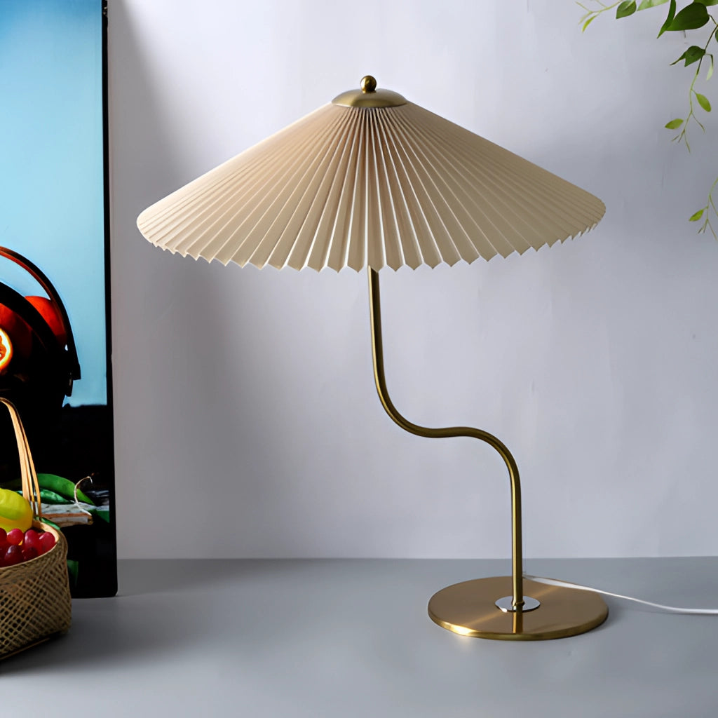 Khaki table lamp with an umbrella-shaped shade featuring a yellow diamond pattern and floral designs, set on a wooden base.