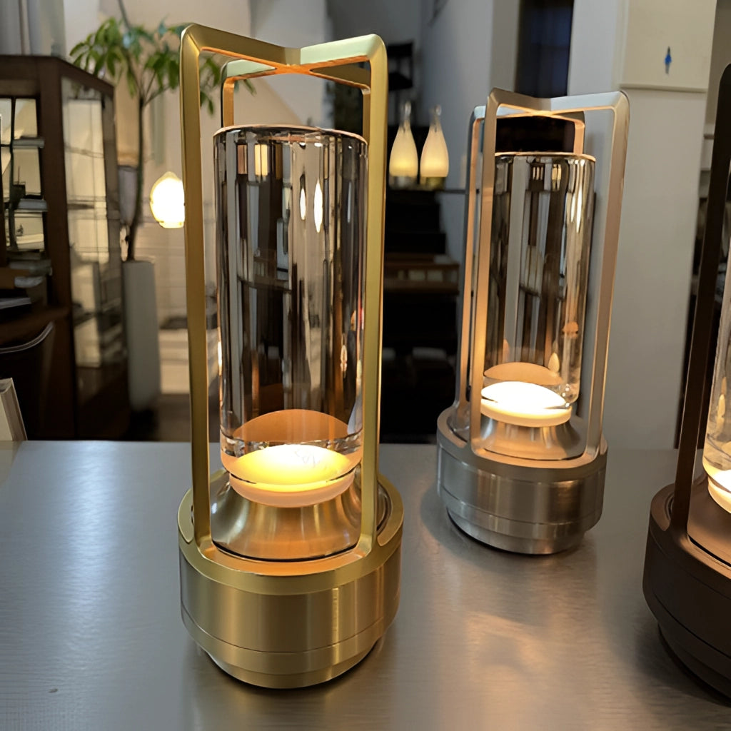 Table lamp with dimming feature and masterful craftsmanship, showcasing a sleek cylindrical metal base and a glass shade.