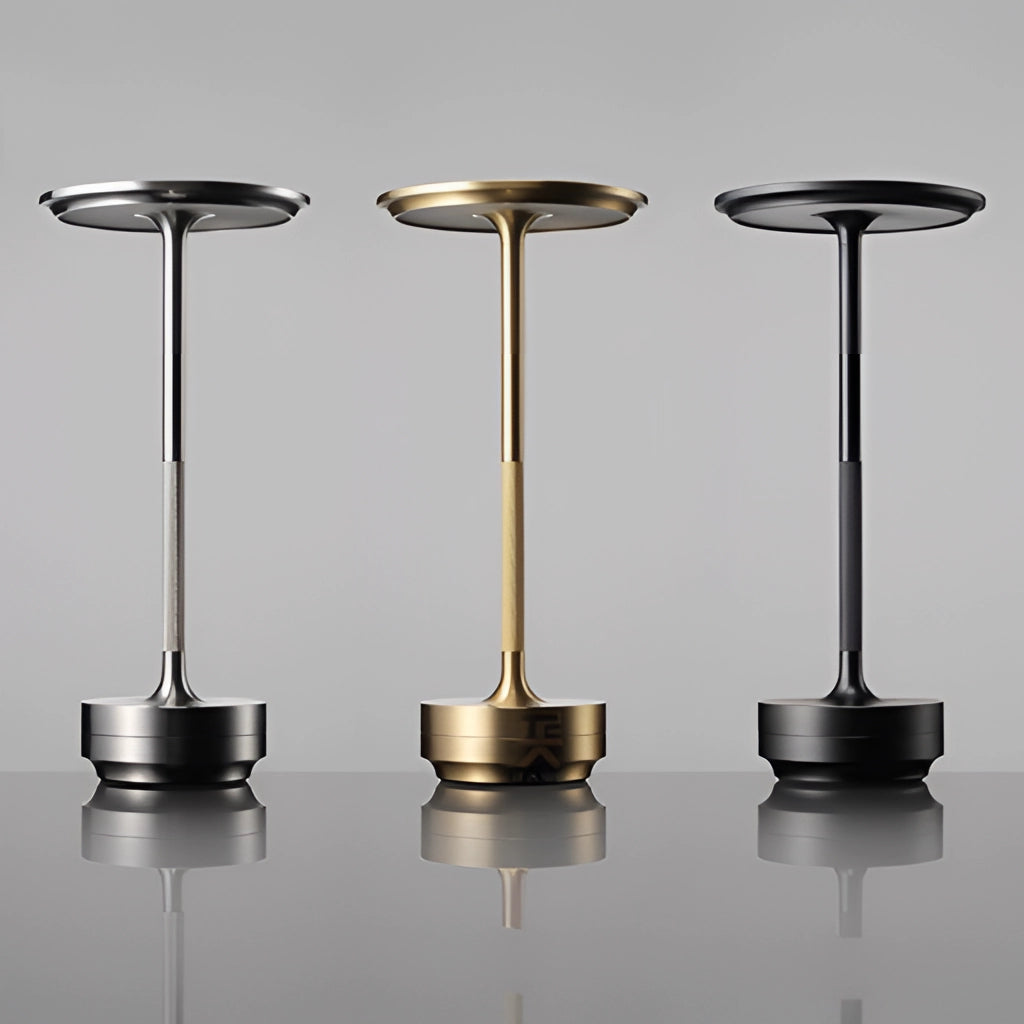 A white table lamp with a cylindrical base and dimming feature, showcasing masterful craftsmanship, positioned on a table and emitting soft light.