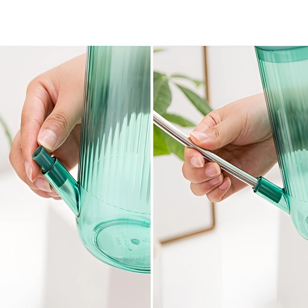 A person holding a watering can with an extended spout for accurate water delivery, focusing on the hand and fingers gripping the can.