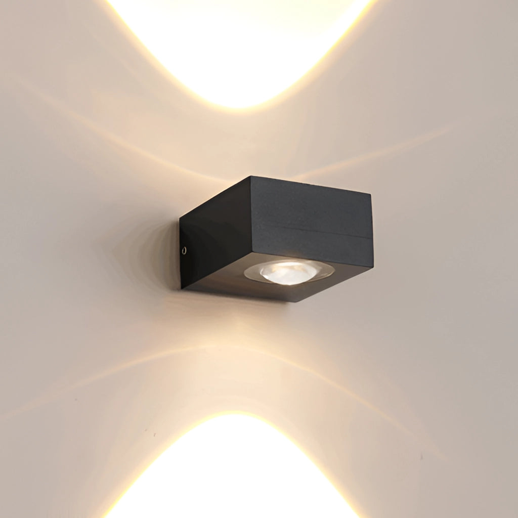 Waterproof black UFO-shaped wall light mounted on a wooden surface, showcasing its sleek metal and composite material design.