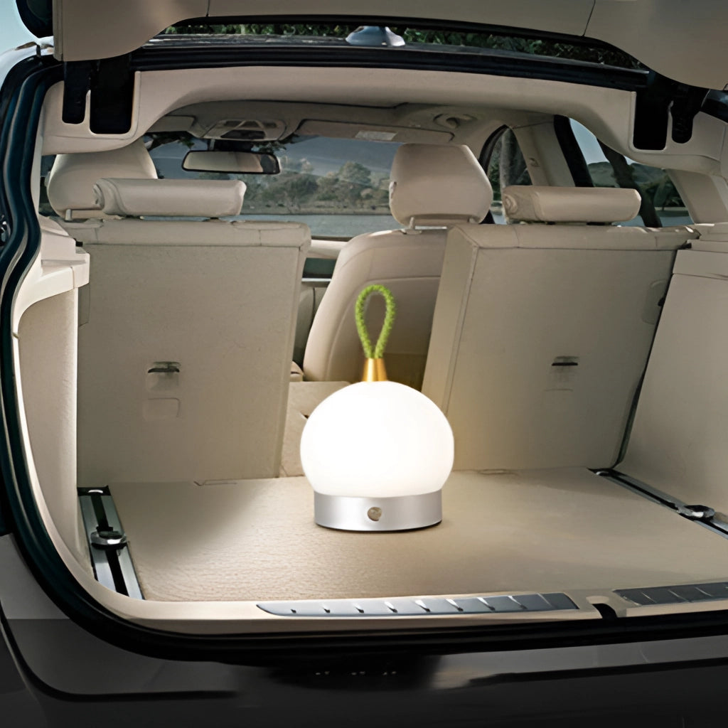 A waterproof LED lamp blimp with quick charging, shown cordless on a nightstand, emitting soft light.