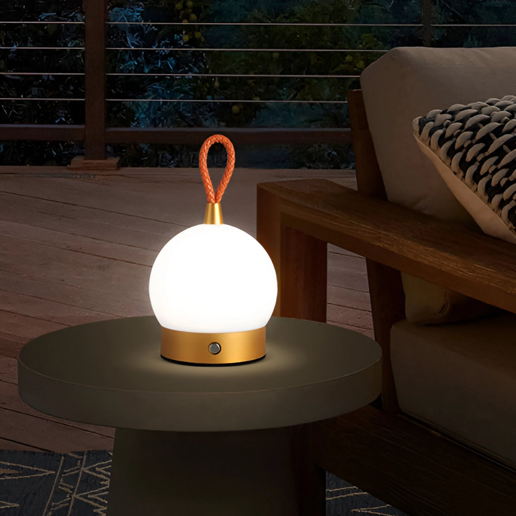 Waterproof cordless LED lamp with a wooden base, placed on a nightstand, illuminating a room with modern interior design elements.