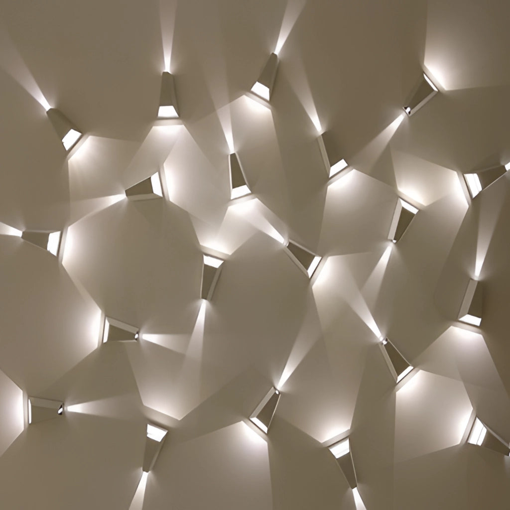 Waterproof Outdoor Pyramid LED Wall Sconce with sleek triangular design, mounted on an exterior wall, emitting subtle, symmetrical light patterns.