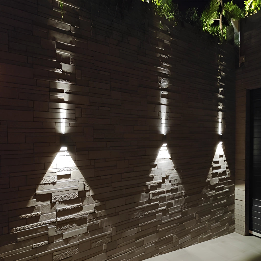 Waterproof Outdoor Pyramid LED Wall Sconce mounted on a wooden facade, showcasing a triangular design with modern urban aesthetic.