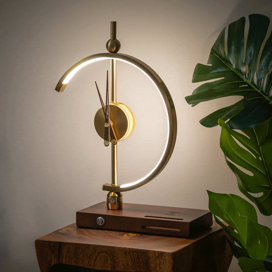 Wireless charging clock lamp with LED light and integrated clock on a wooden table beside a houseplant.