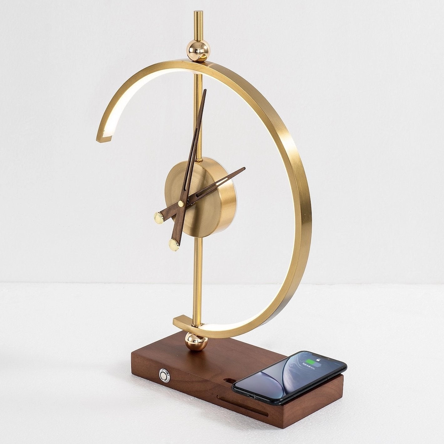 Wireless charging clock lamp with LED light, featuring a wooden base, integrated clock, and metal accents.