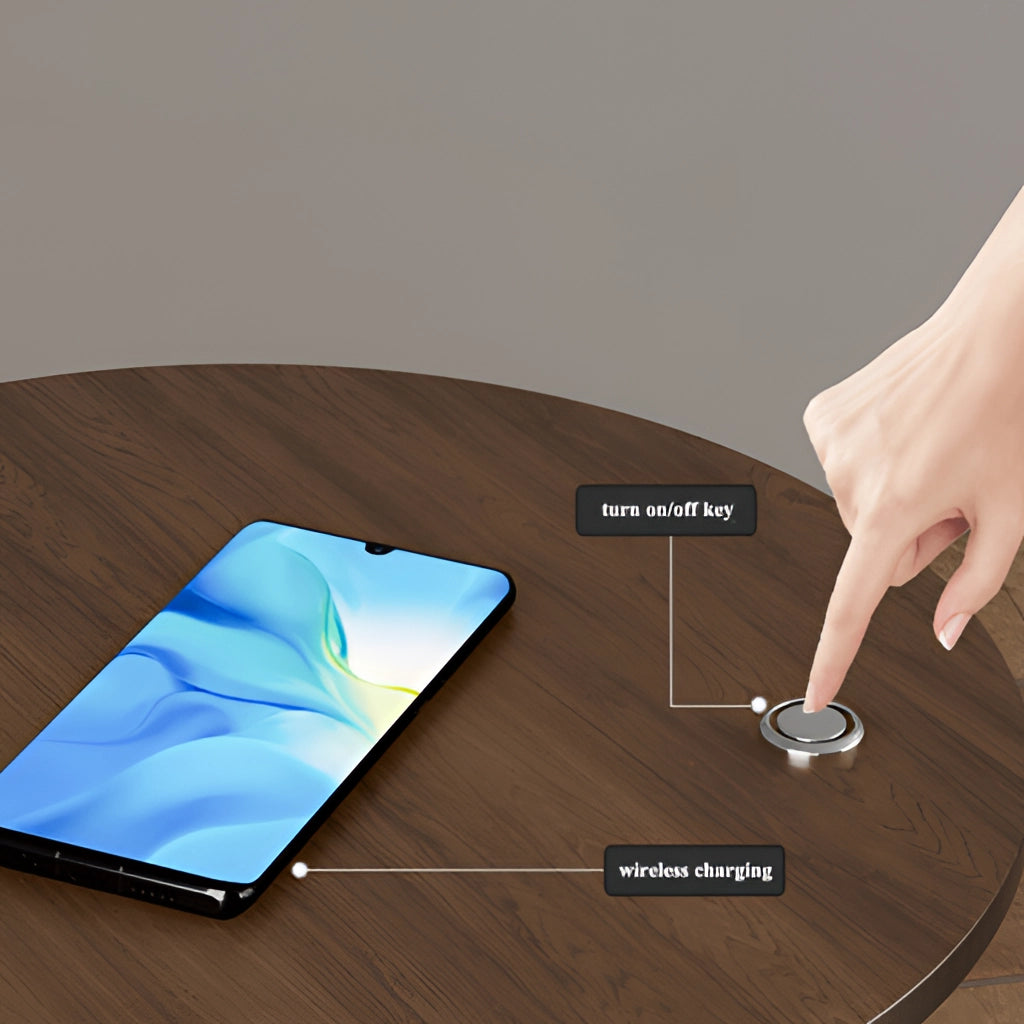 A sleek wooden desk with a built-in wireless charging station, featuring a modern personal computer setup.