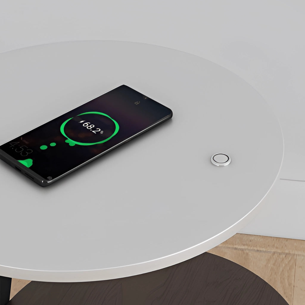 Wireless charging premium desk with a grey surface, featuring a communication device, audio equipment, and a portable communications device.