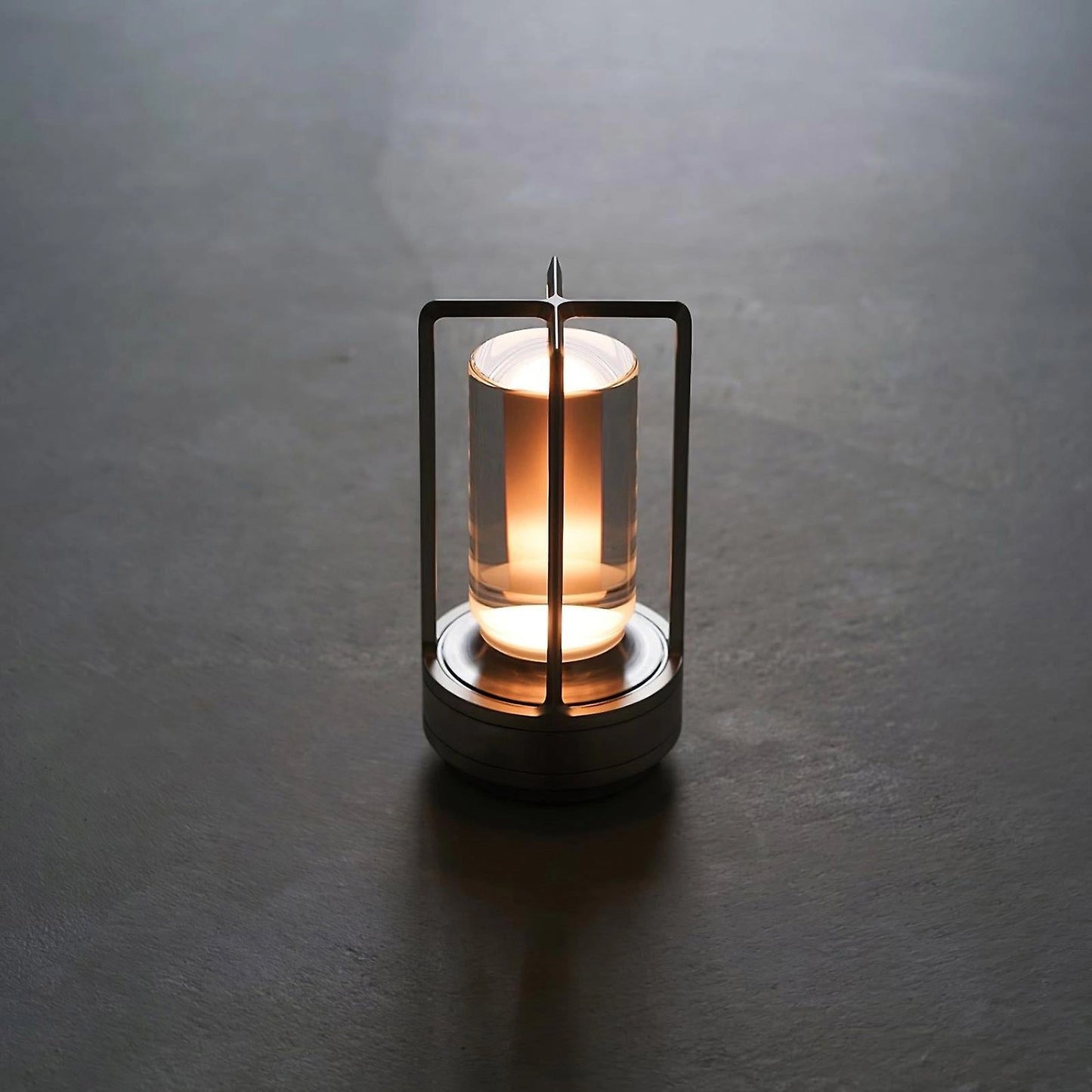 A sleek, rectangular wireless crystal lantern table lamp with an amber glow, featuring a cylindrical wooden base, rechargeable and waterproof design.