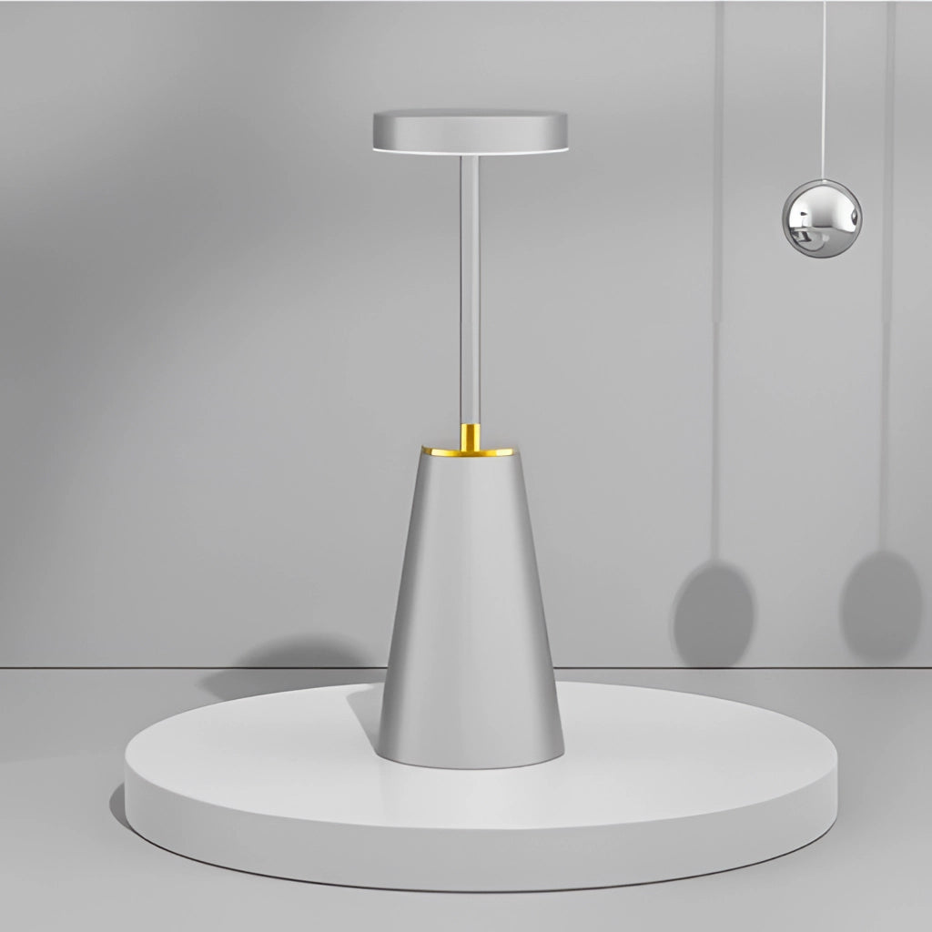 Wireless LED table lamp in gray aluminum alloy with touch technology, 3 color dimming, and 4000mAh battery, sleek cylindrical design.