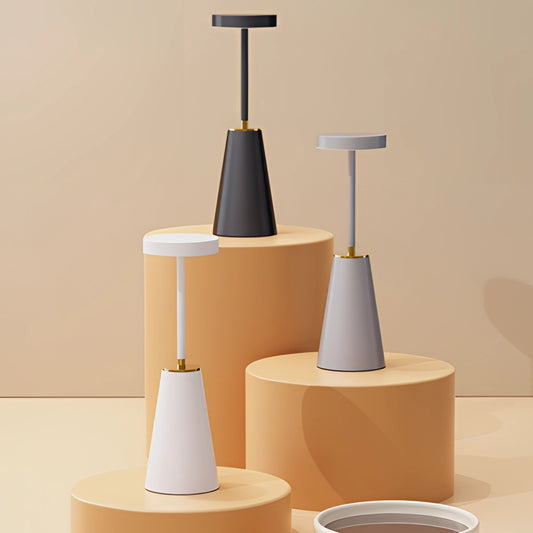 Wireless LED Table Lamp with Touch Technology on a wooden table, showcasing its aluminum alloy design and sleek cylindrical shape.