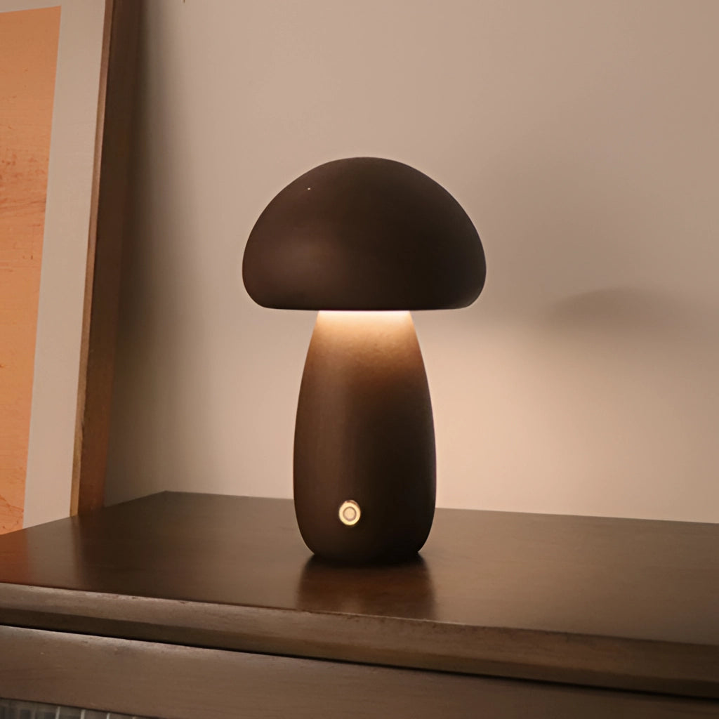 Wood Effect Mushroom Cordless Table Lamp in Dark Wood finish, placed on a table in a stylish interior setting.